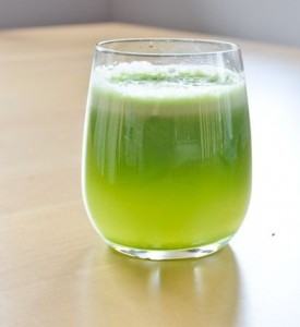 glass of bright green juice